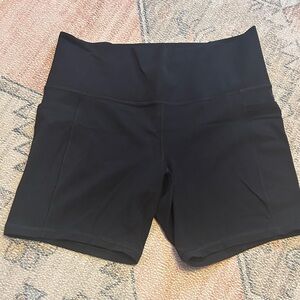 Athleta Black Salutation 7 inch Stash Bike Shorts